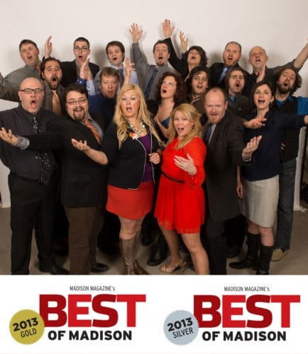 A lively group of 20 people celebrating, with arms raised and joyful expressions, showcasing awards for "Best of Madison."