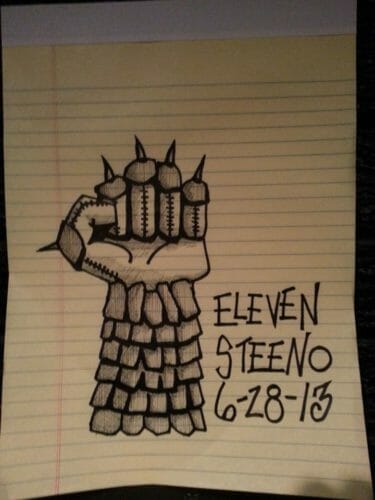 A detailed drawing of a spiked fist on lined paper, labeled "ELEVEN STEENO 6-28-13."
