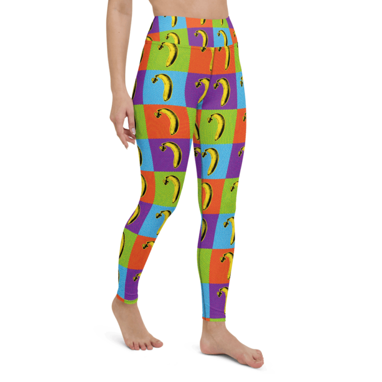 Colorful leggings featuring a playful banana pattern on a patchwork background of vibrant squares.
