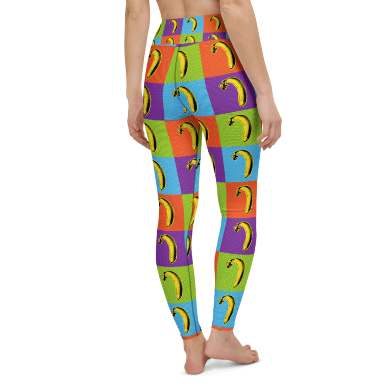 Colorful leggings featuring a playful banana print on a patchwork background of vibrant squares.